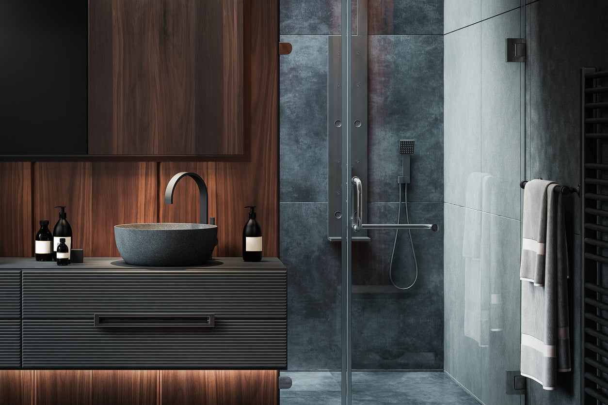 An inviting bathroom space equipped with a minimalist sink, a glass shower enclosure, and warm lighting for relaxation.