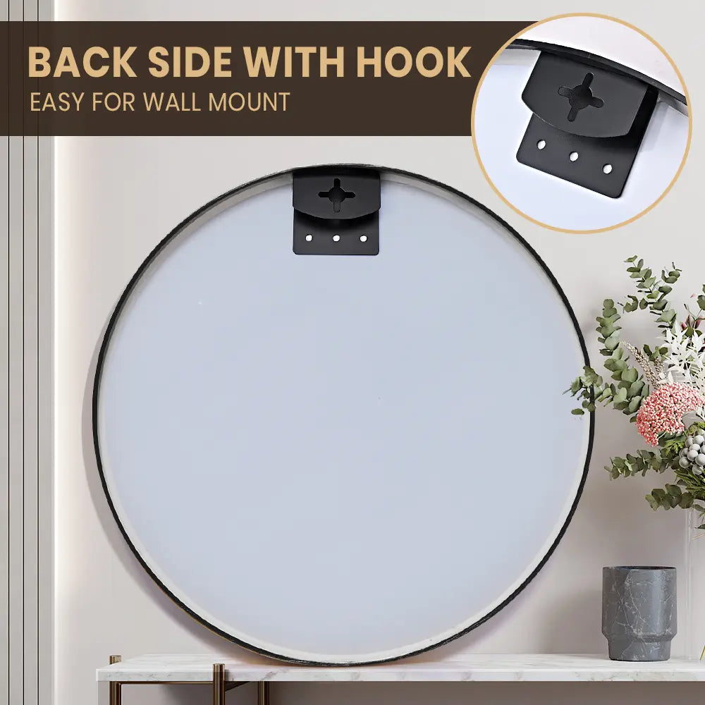 Round bathroom mirror with slim aluminium frame mounted on a tiled wall