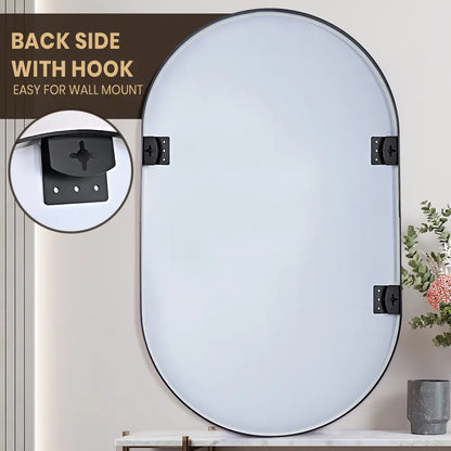 Oval bathroom mirror with sturdy aluminium frame above a sleek vanity