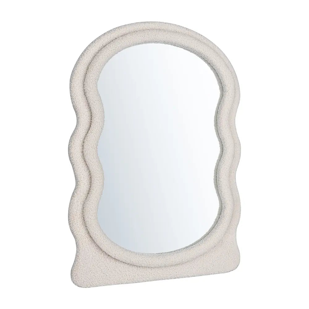 Wall mirror with boucle-wrapped frame close-up