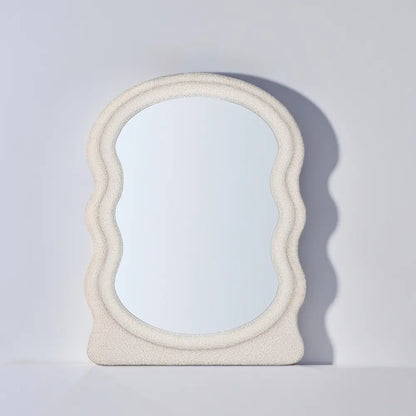 Verity boucle mirror hanging in a cozy entryway