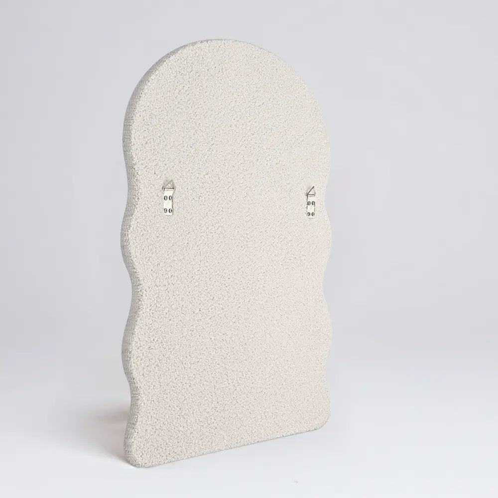 Soft-textured boucle wall mirror frame back view