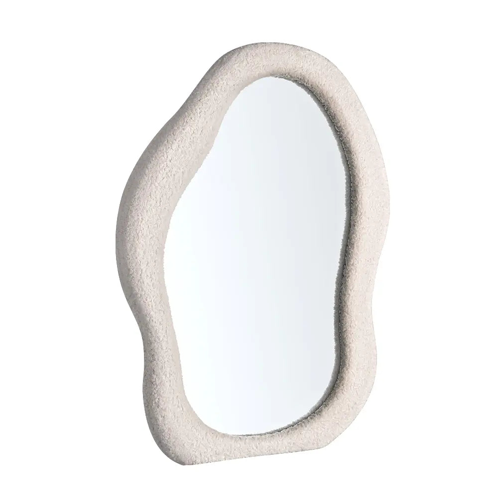 Wall mirror with fabric-wrapped frame close-up