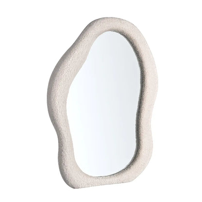 Wall mirror with fabric-wrapped frame close-up