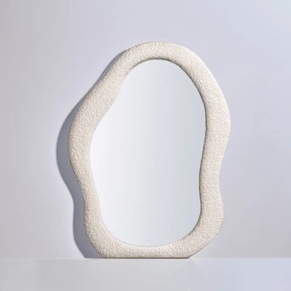 Mikko fabric mirror hanging above a console table