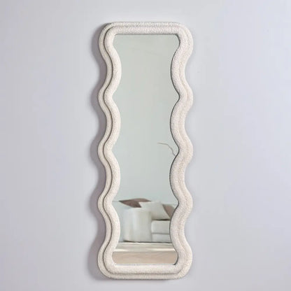 Stylish wavy-framed full-length mirror close-up