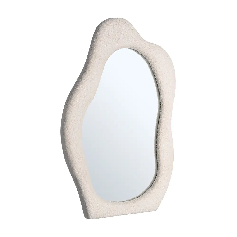 Wall mirror with fabric-wrapped frame close-up