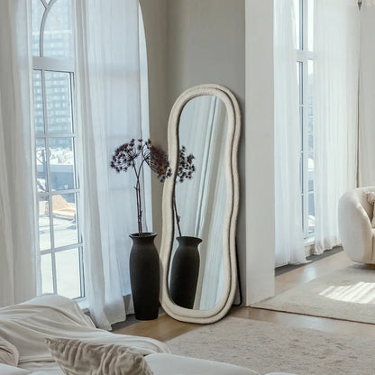 Sylas fabric mirror leaning against a living room wall