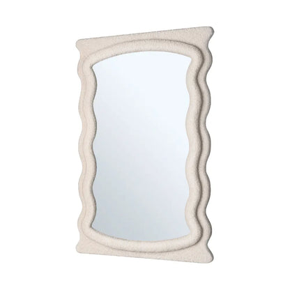 Wall mirror with fabric-wrapped frame close-up