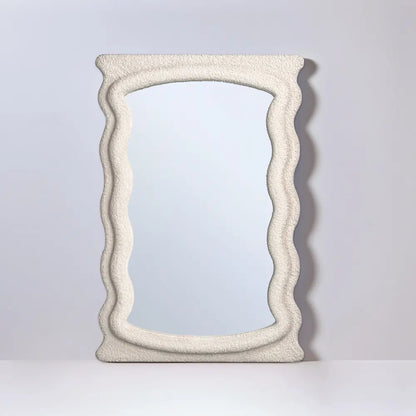 Saige fabric mirror hanging above a console table