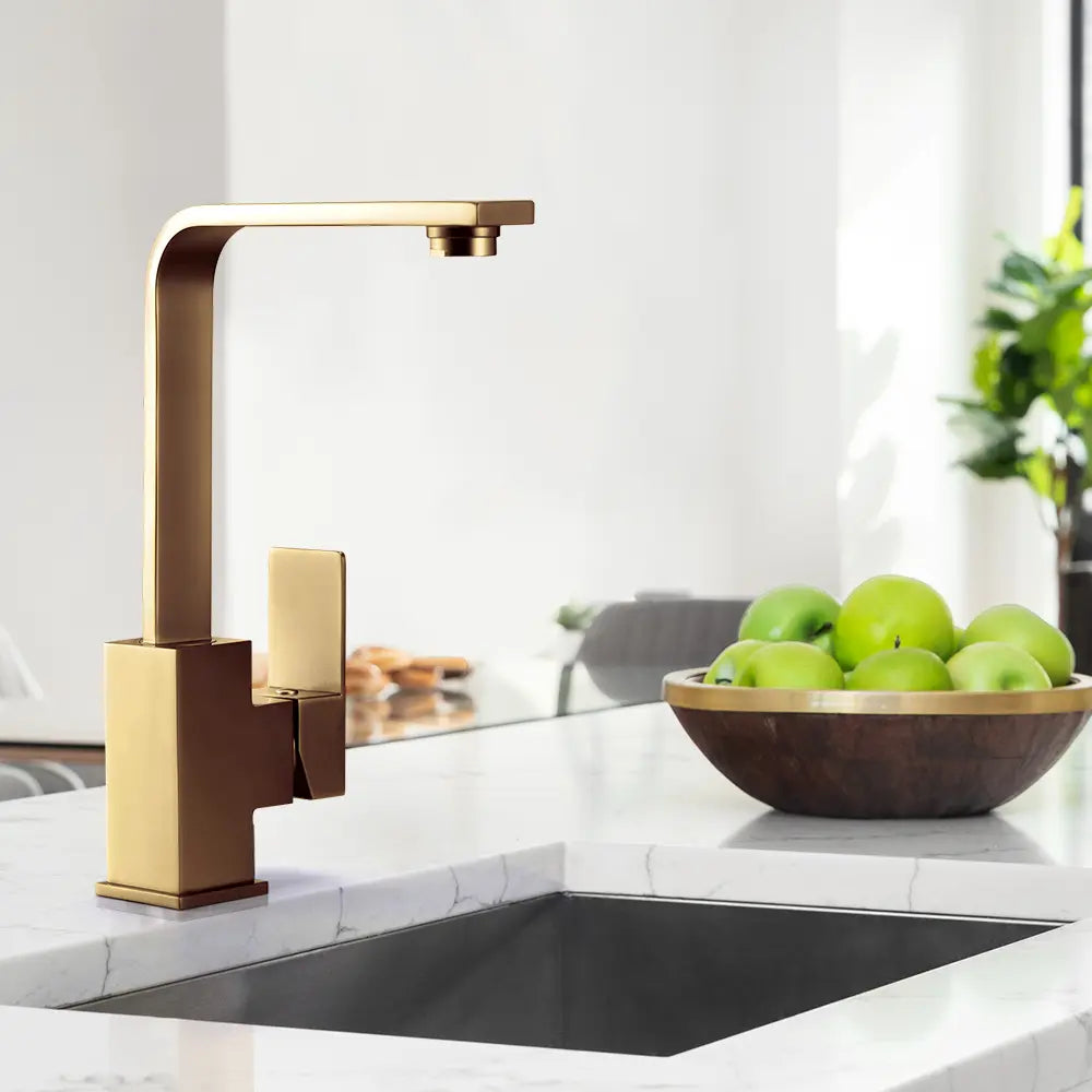 Modern Ivy Slimline Square Mixer Tap installed in kitchen in gold