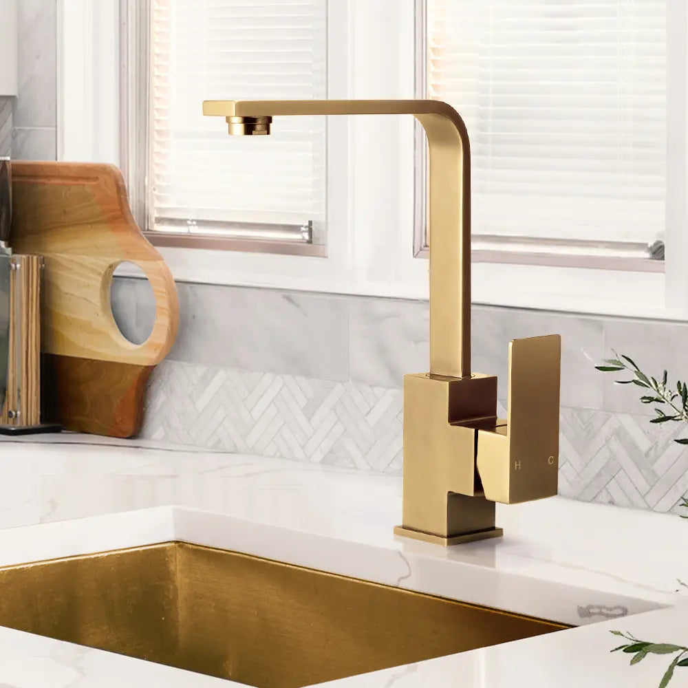 Side view of Ivy Square Sink Mixer Tap in action in gold