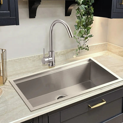 Jeni Slimline Gooseneck Tap paired with deep kitchen sink in silver