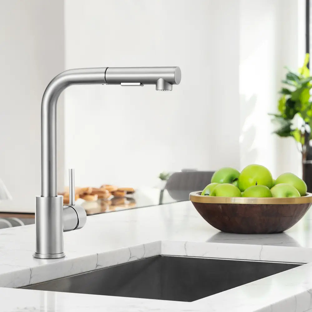 Beca square pull-out tap installed in a modern kitchen sink