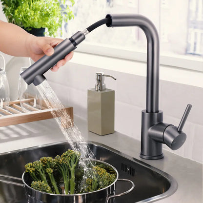 Hands using the pull-out spout on Beca square mixer tap