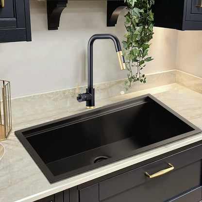 Matte black Kiko Tap installed in a kitchen sink
