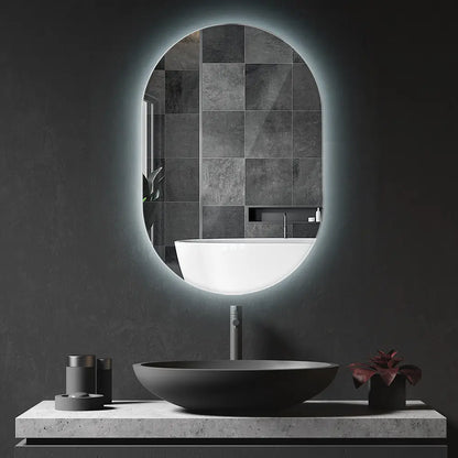 Frameless oval LED lighted wall mirror with backlit illumination in modern bathroom