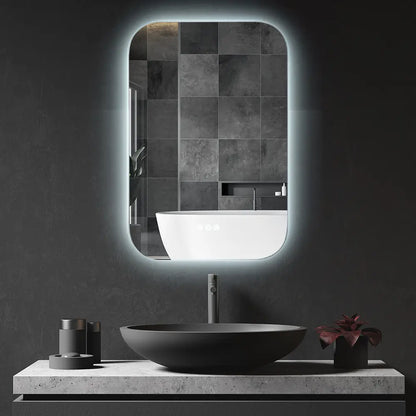 Frameless rectangular vertical LED wall mirror with rounded corners in modern bathroom