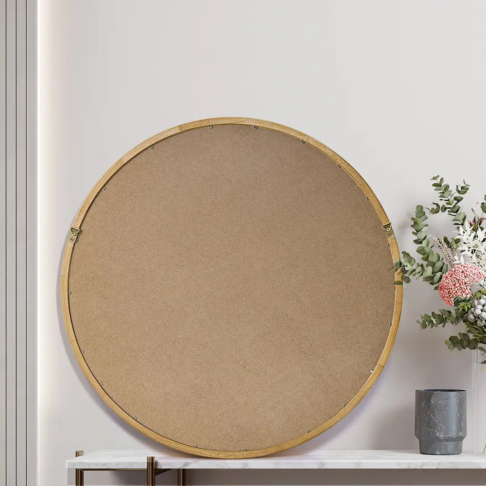 back view of Libra Round Mirror's slim wood frame