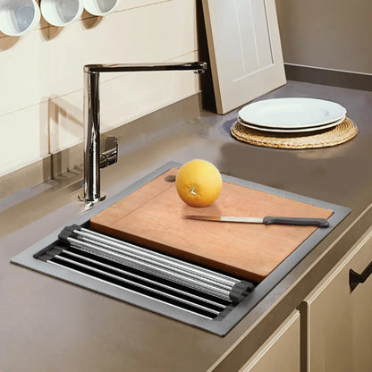 Overhead view of Sima-Plus sink showing cutting board and orange